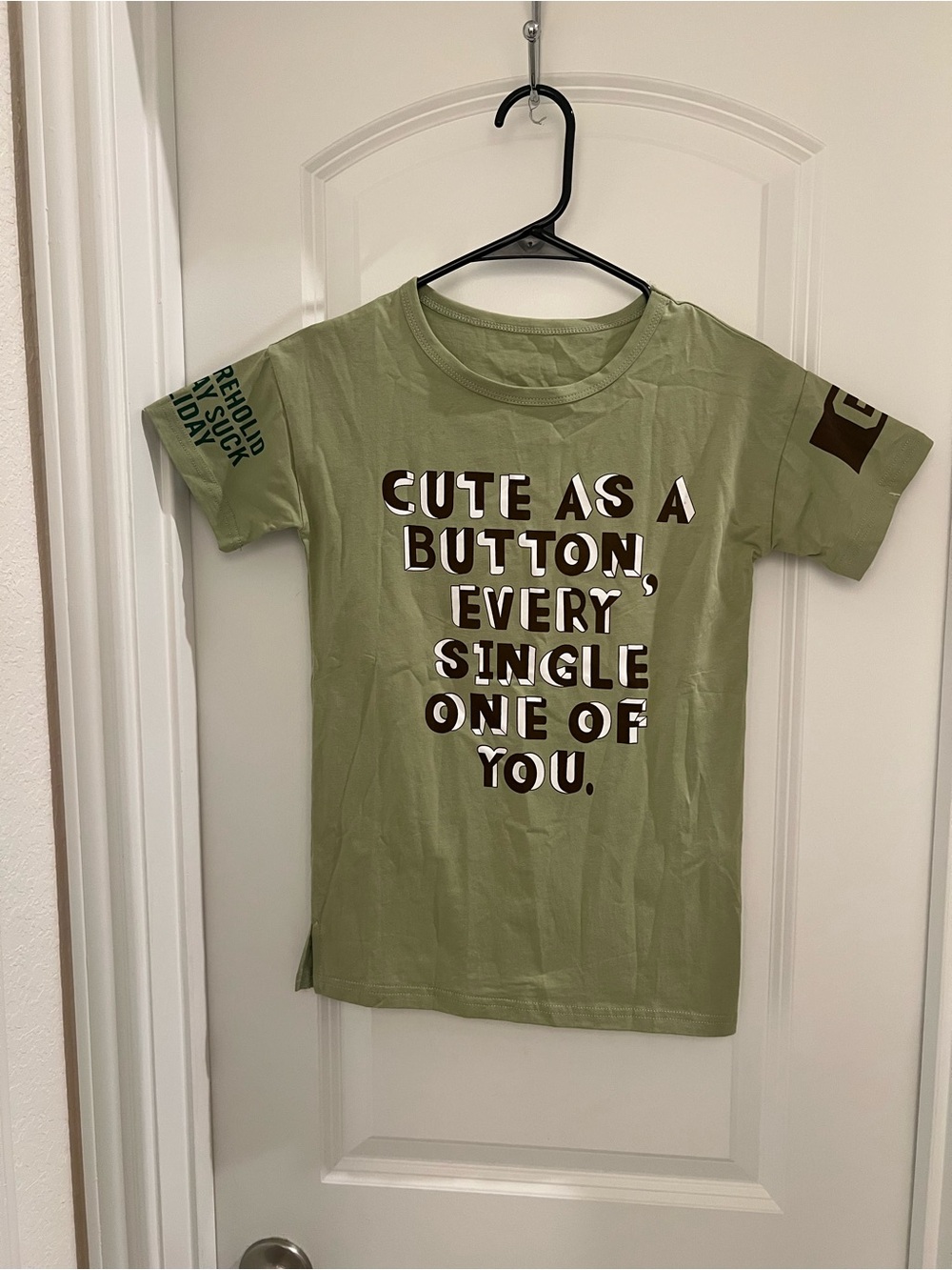 New without tags olive green kids’ graphic T-shirt with a fun, unique design.